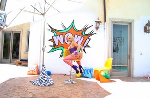 18 year old female Doris G slips off her underwear to pose naked on her bed